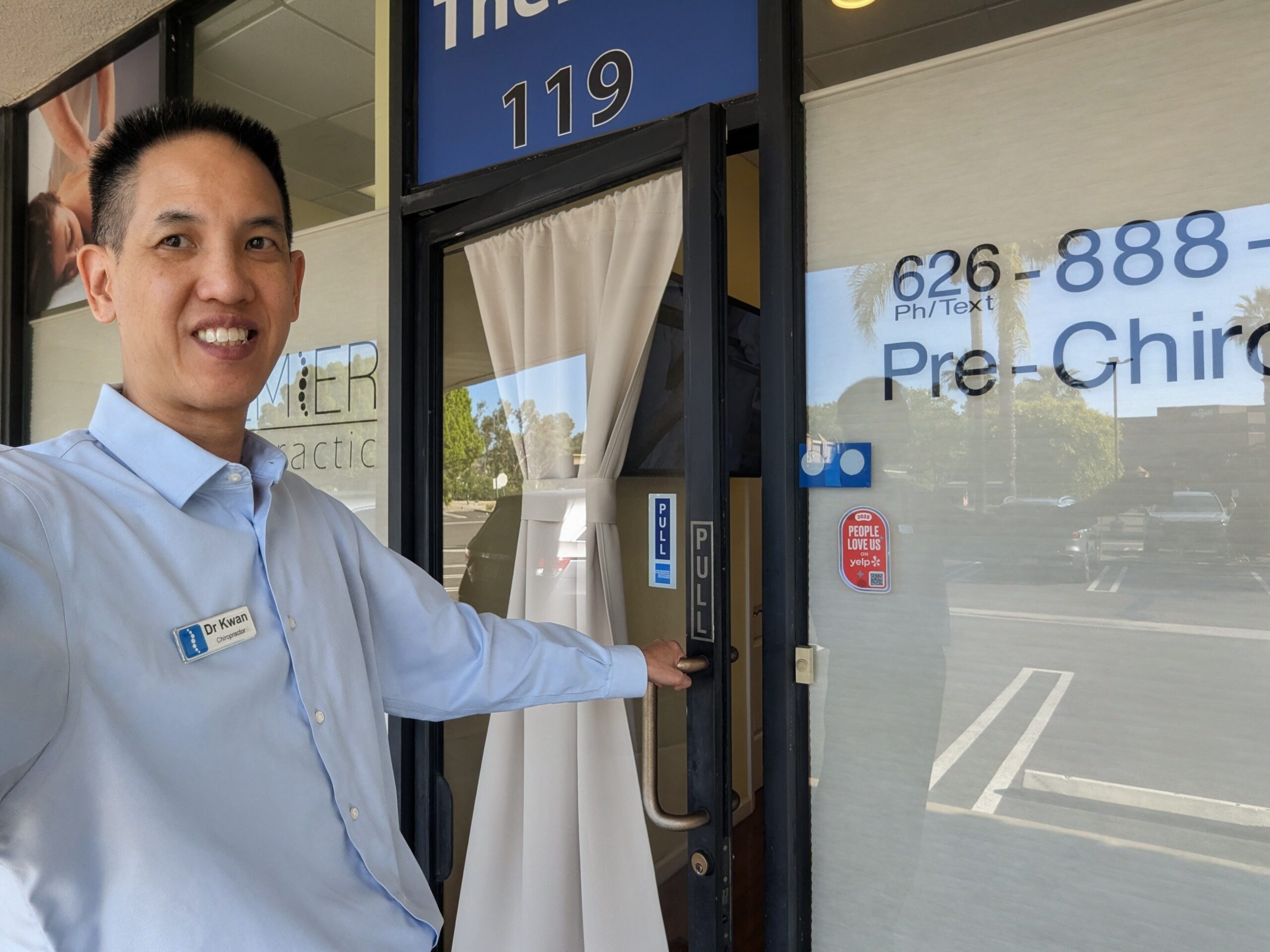 Dr Kwan walking into the Premier Massage & Chiropractic of Arcadia office.