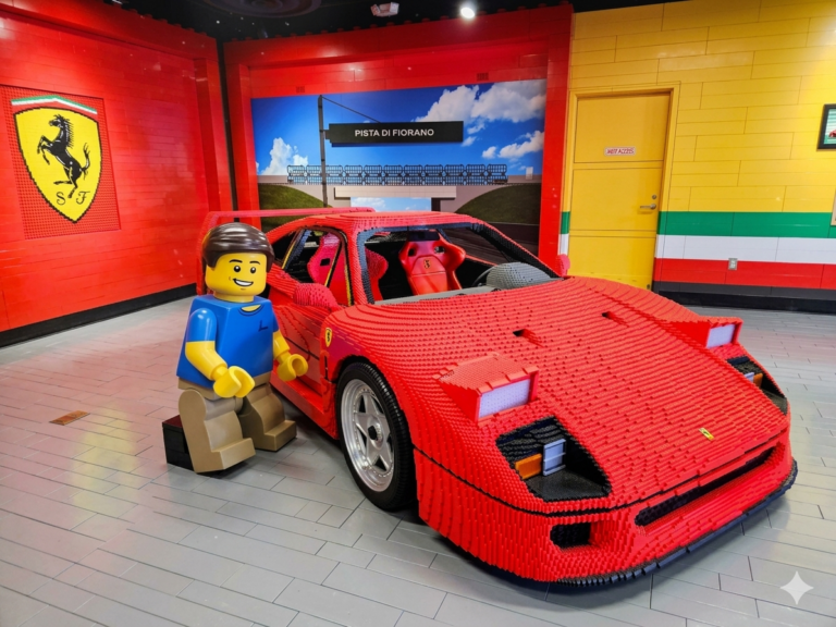 Lego Dr Kwan kneeling in front of Lego Ferrari F40